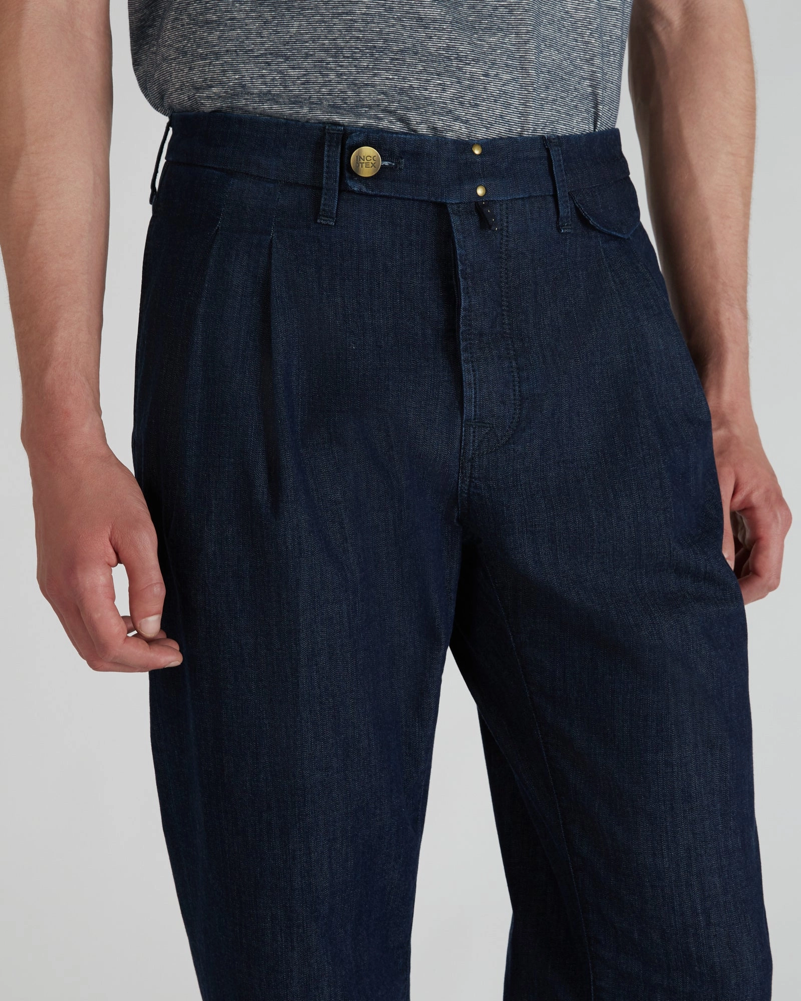 Tapered-fit trousers in stretch denim Body-Hugging Fit Hidden Pocket System