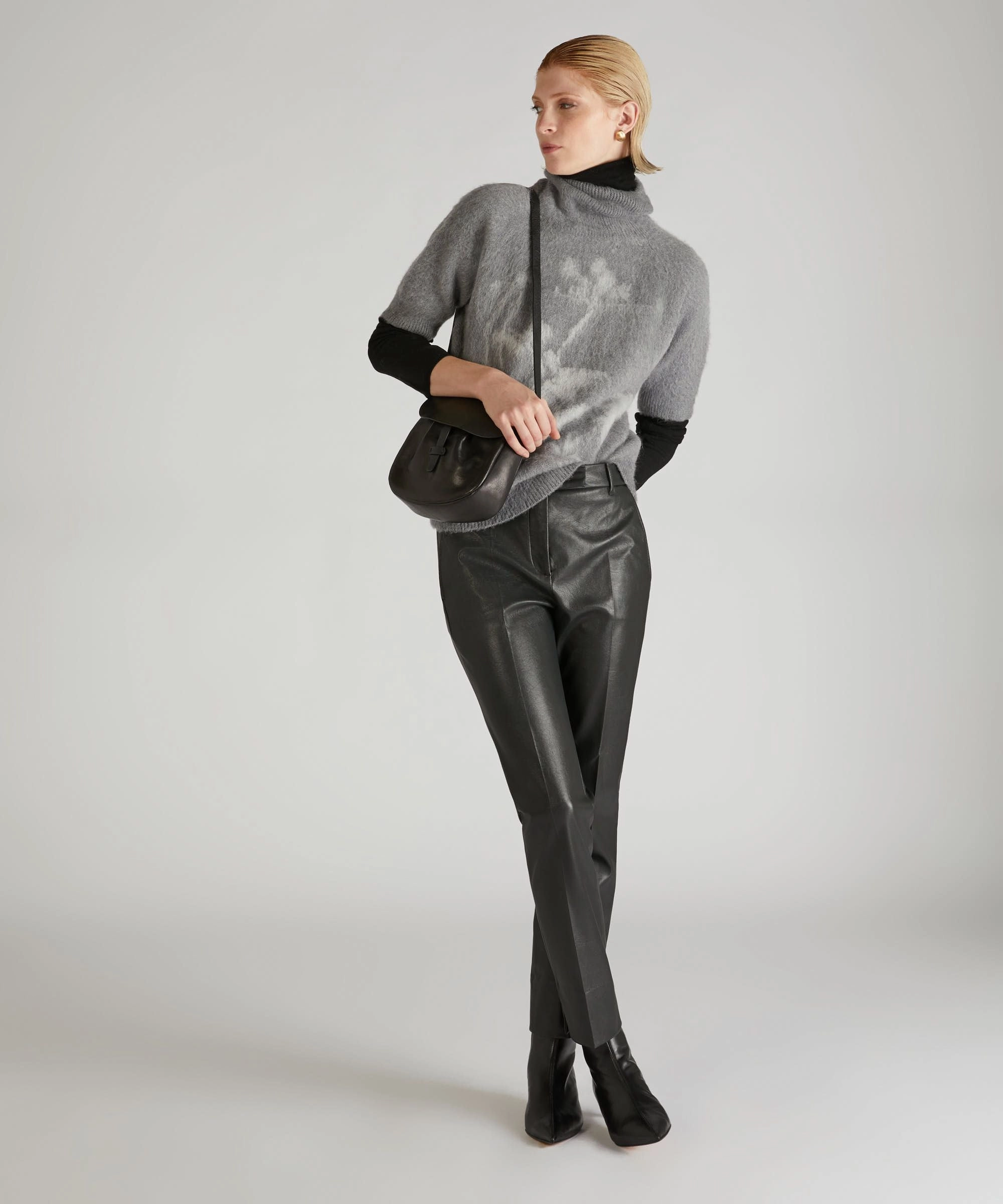 Slim-fit trousers in stretch faux leather Dynamic Flex Panels Utility Style