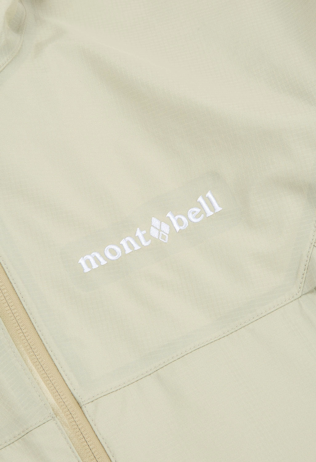 Sporty Touch Hidden Storage Compartments Montbell Women's Rain Trekker 2.0 Jacket - Ivory